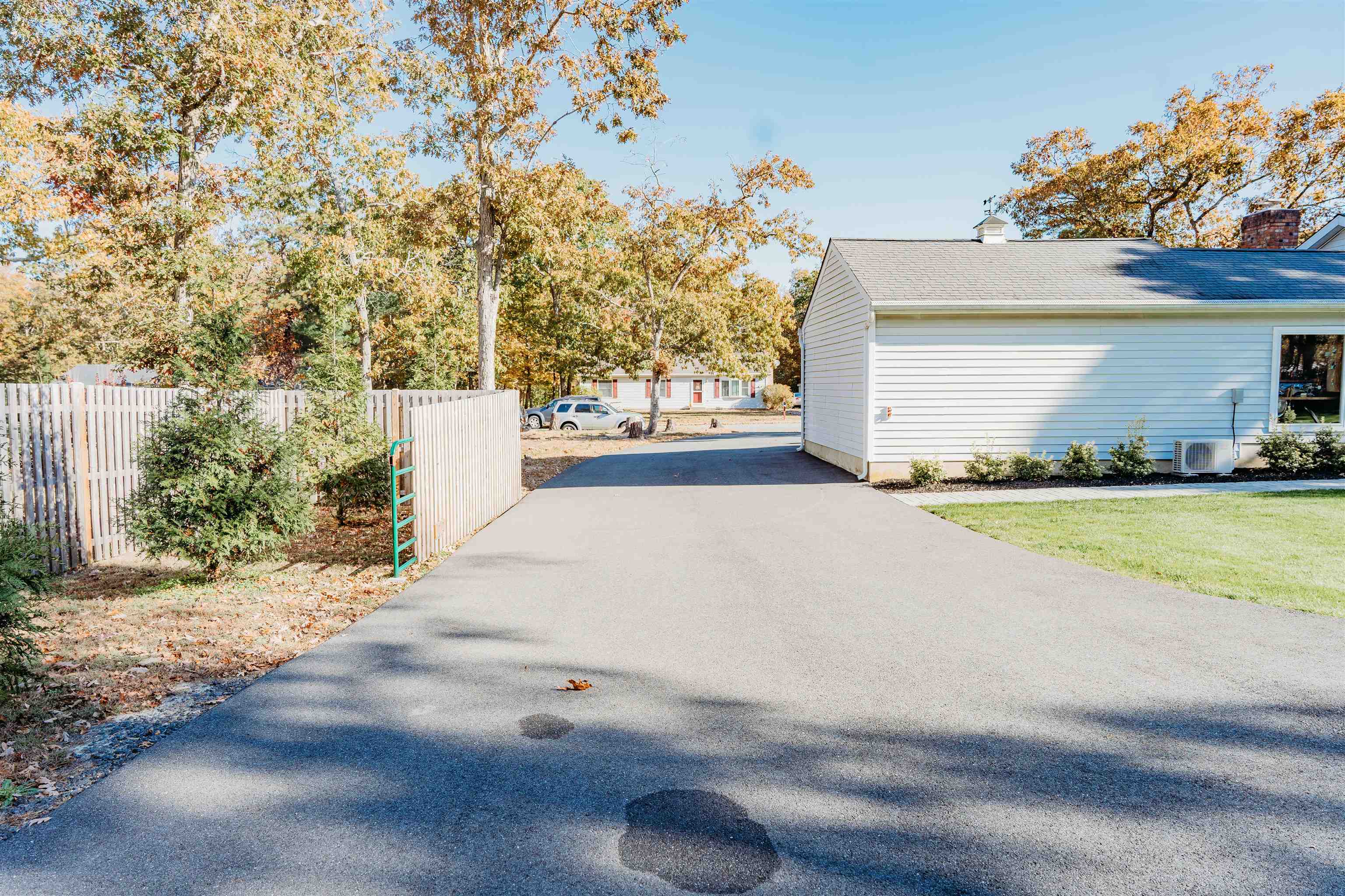 8 Indian Walk Road Ocean View, NJ 08230 - Photo 5 of 44 a view of a house with a yard and potted plants