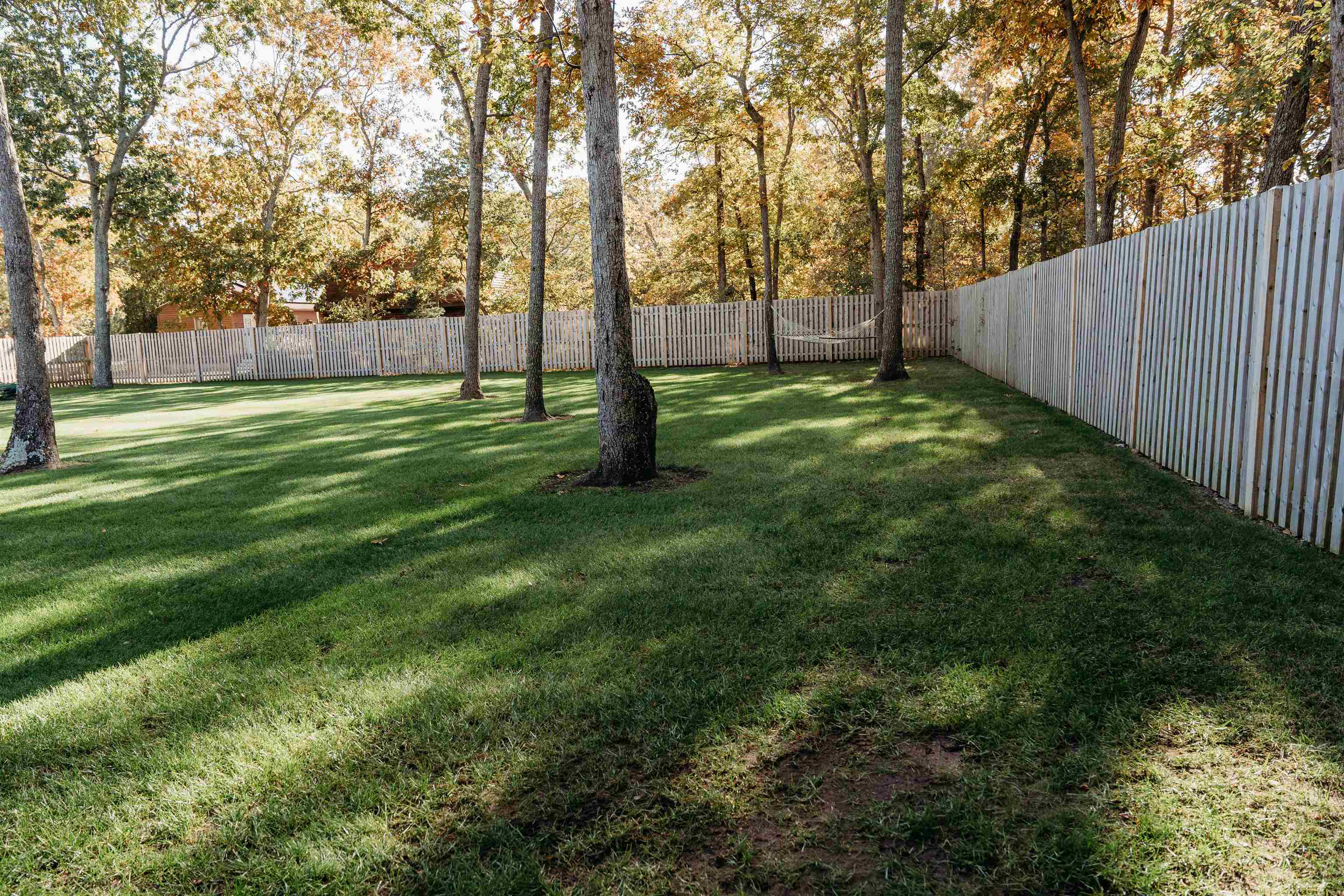 8 Indian Walk Road Ocean View, NJ 08230 - Photo 7 of 44 a view of green field with trees in the background