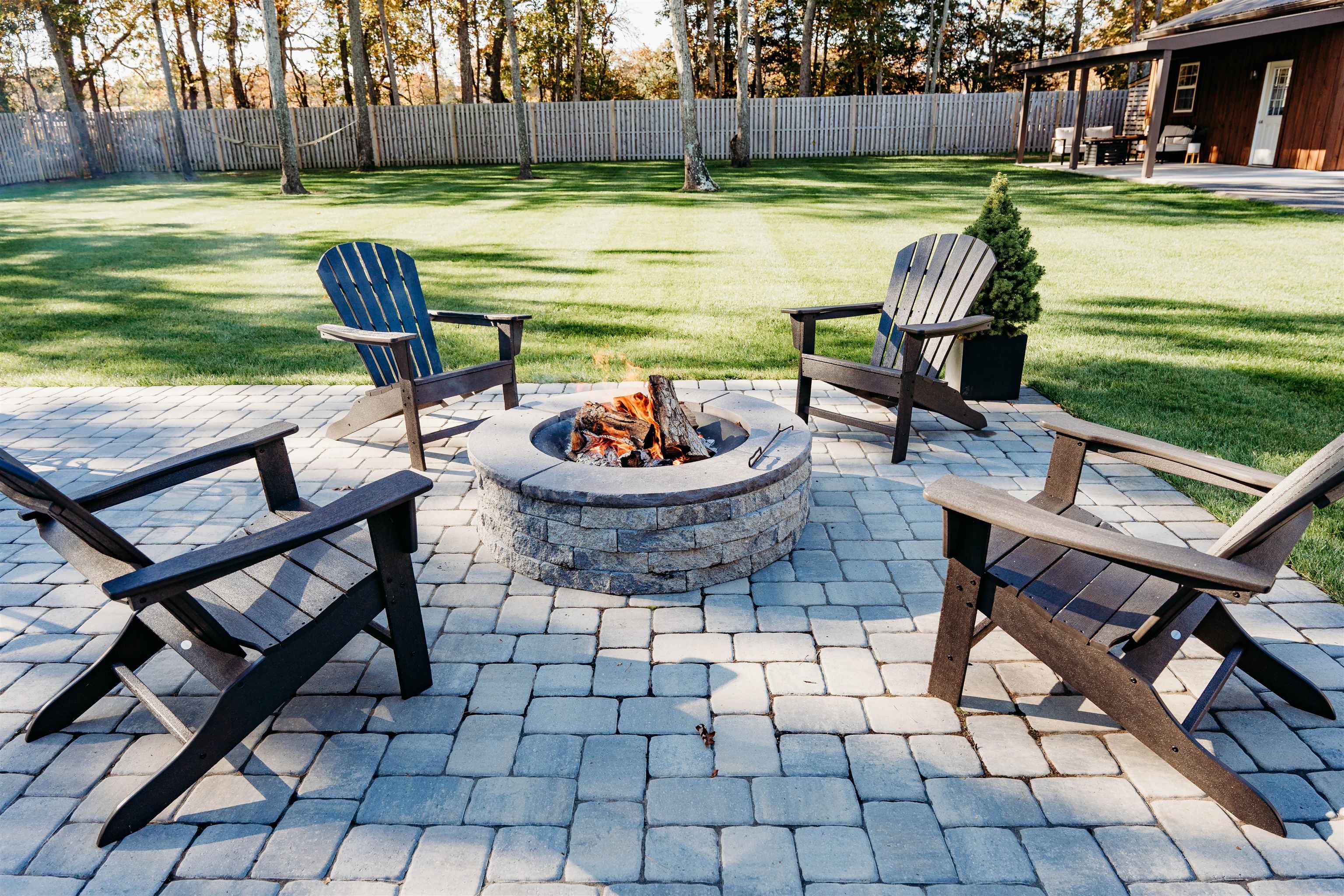 8 Indian Walk Road Ocean View, NJ 08230 - Photo 8 of 44 a swimming pool with barbeque oven table and chairs