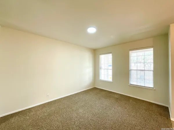 an empty room with a windows