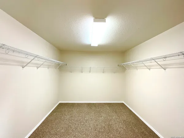 a view of a room with racks on the wall