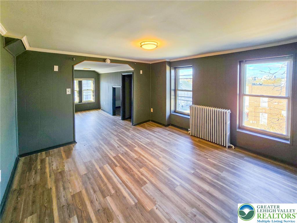 703 South Filmore Street Allentown, PA 18103 - Photo 11 of 15 a view of a room with wooden floor and stairs