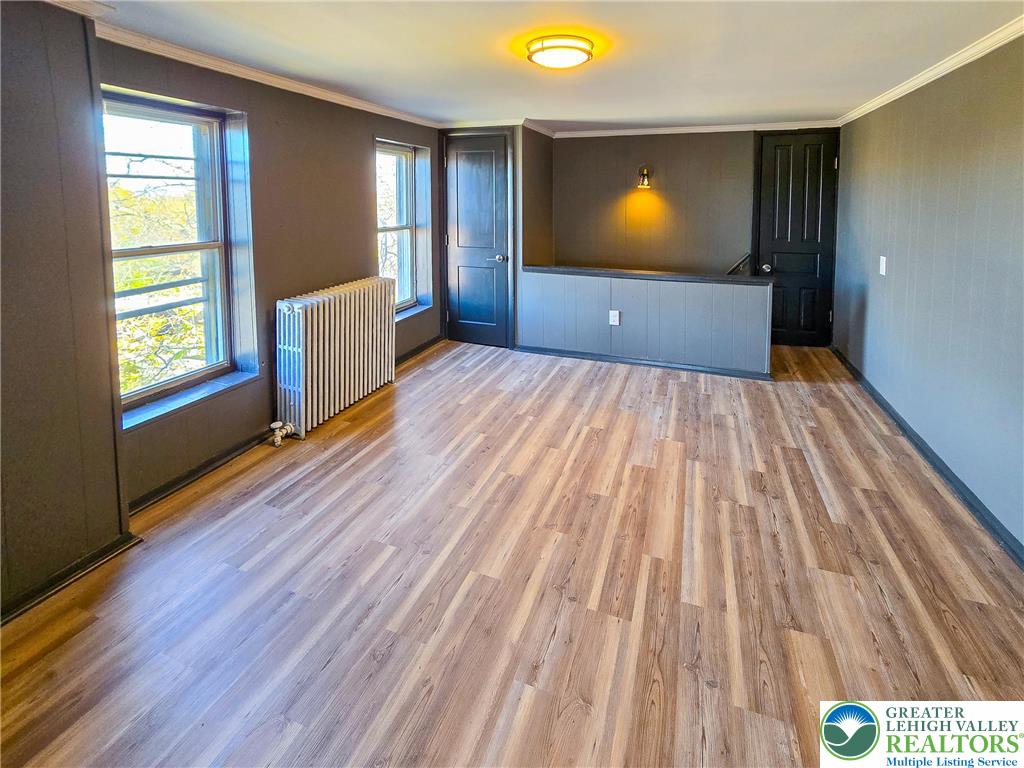 703 South Filmore Street Allentown, PA 18103 - Photo 12 of 15 wooden floor in an empty room with a window