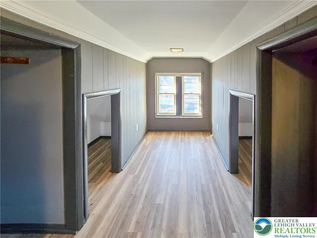 a view of hallway with natural light