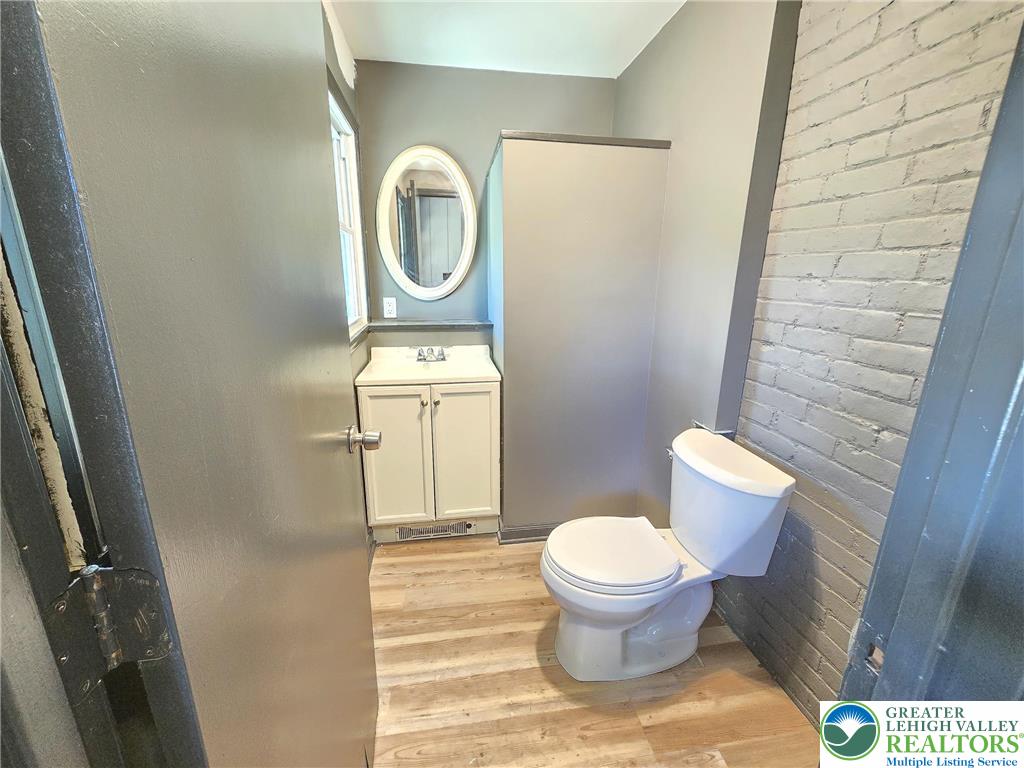 703 South Filmore Street Allentown, PA 18103 - Photo 6 of 15 a bathroom with a toilet and a sink