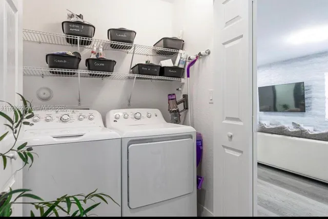 a utility room with dryer and washer