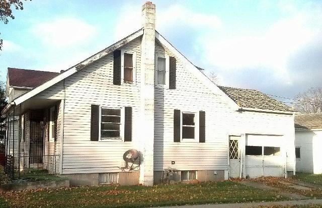601 North 3rd Street Rochelle, IL 61068 - Photo 2 of 3 a front view of a house with a yard