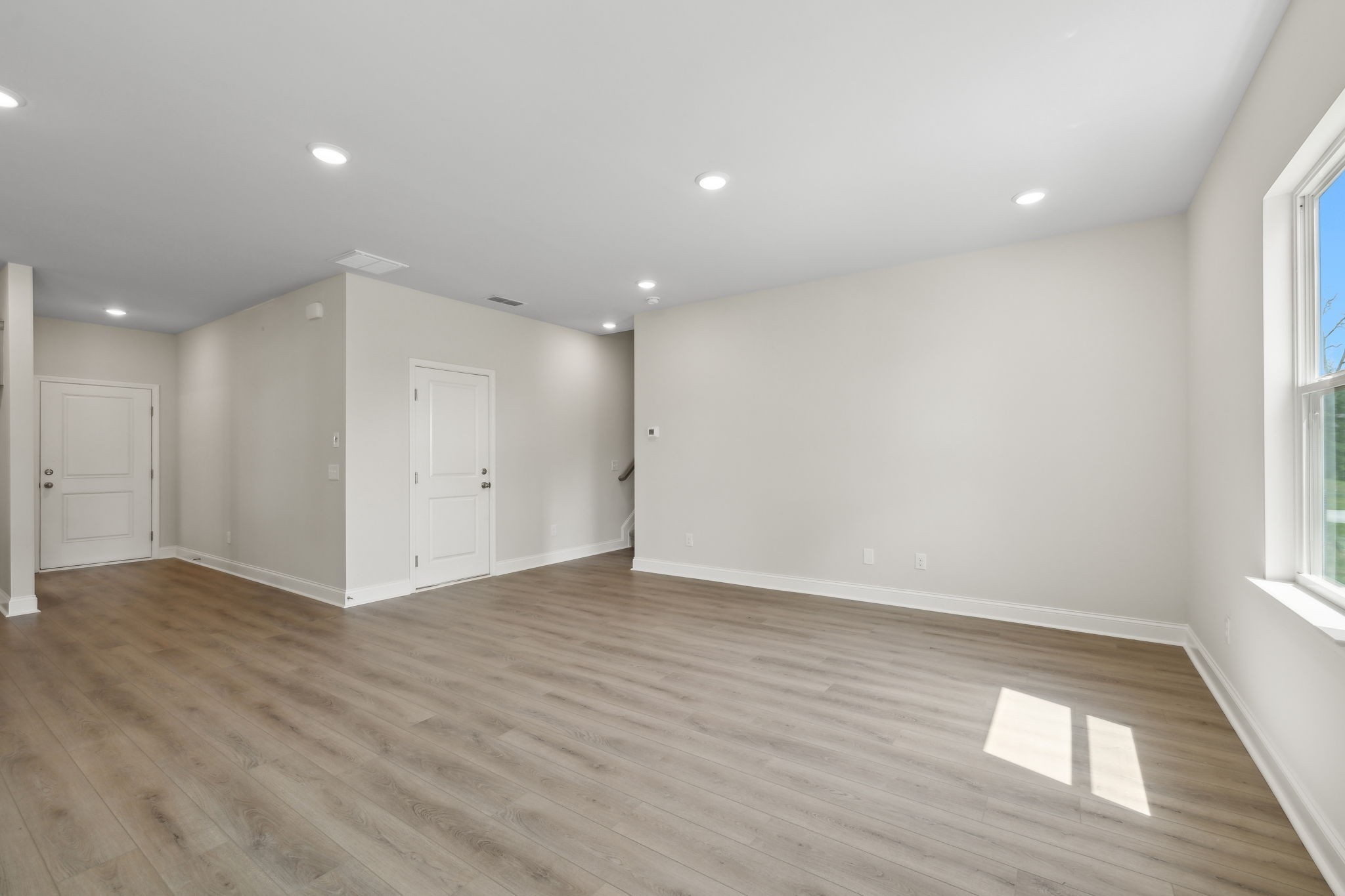 211 Limestone Way Mount Juliet, TN 37122 - Photo 11 of 35 an empty room with wooden floor and windows