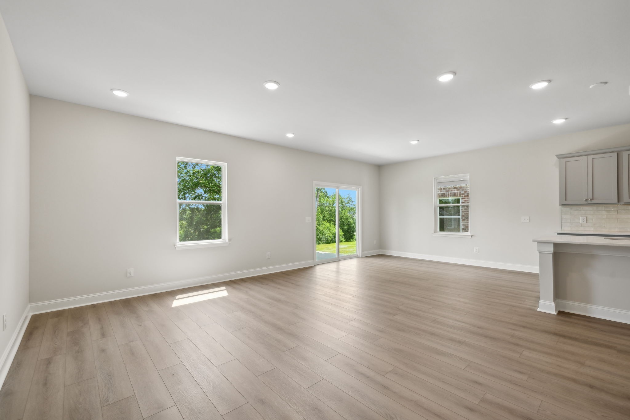 211 Limestone Way Mount Juliet, TN 37122 - Photo 13 of 35 an empty room with wooden floor and windows