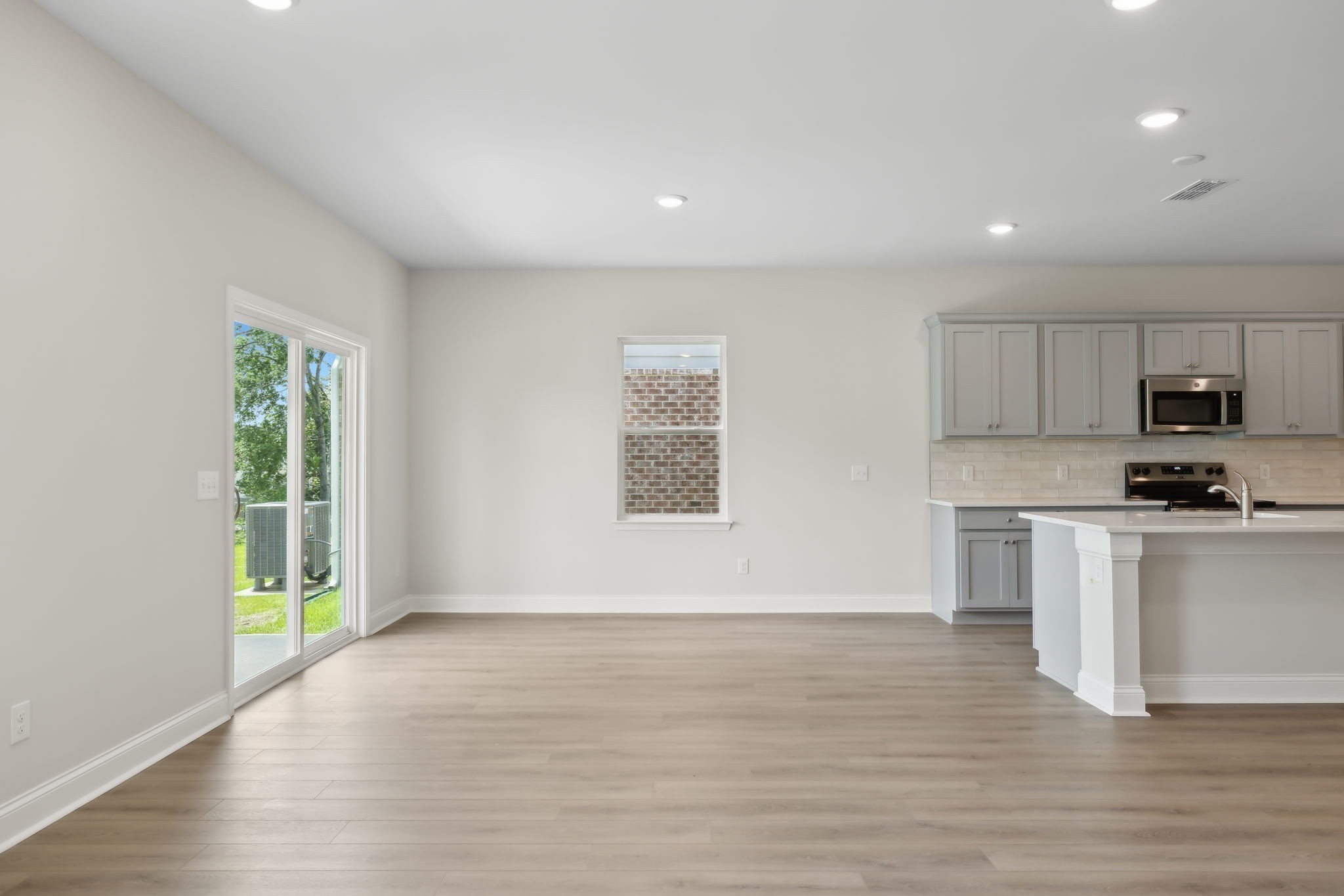 211 Limestone Way Mount Juliet, TN 37122 - Photo 14 of 35 a view of kitchen with granite countertop stainless steel appliances sink and microwave