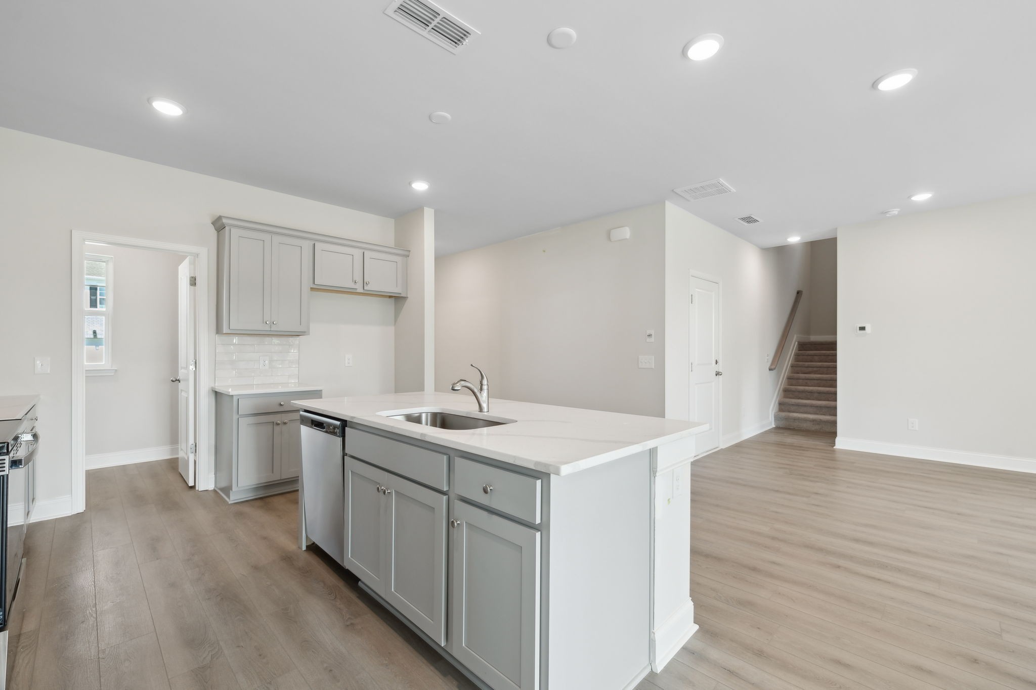 211 Limestone Way Mount Juliet, TN 37122 - Photo 15 of 35 a kitchen with a sink stainless steel appliances and wooden floor