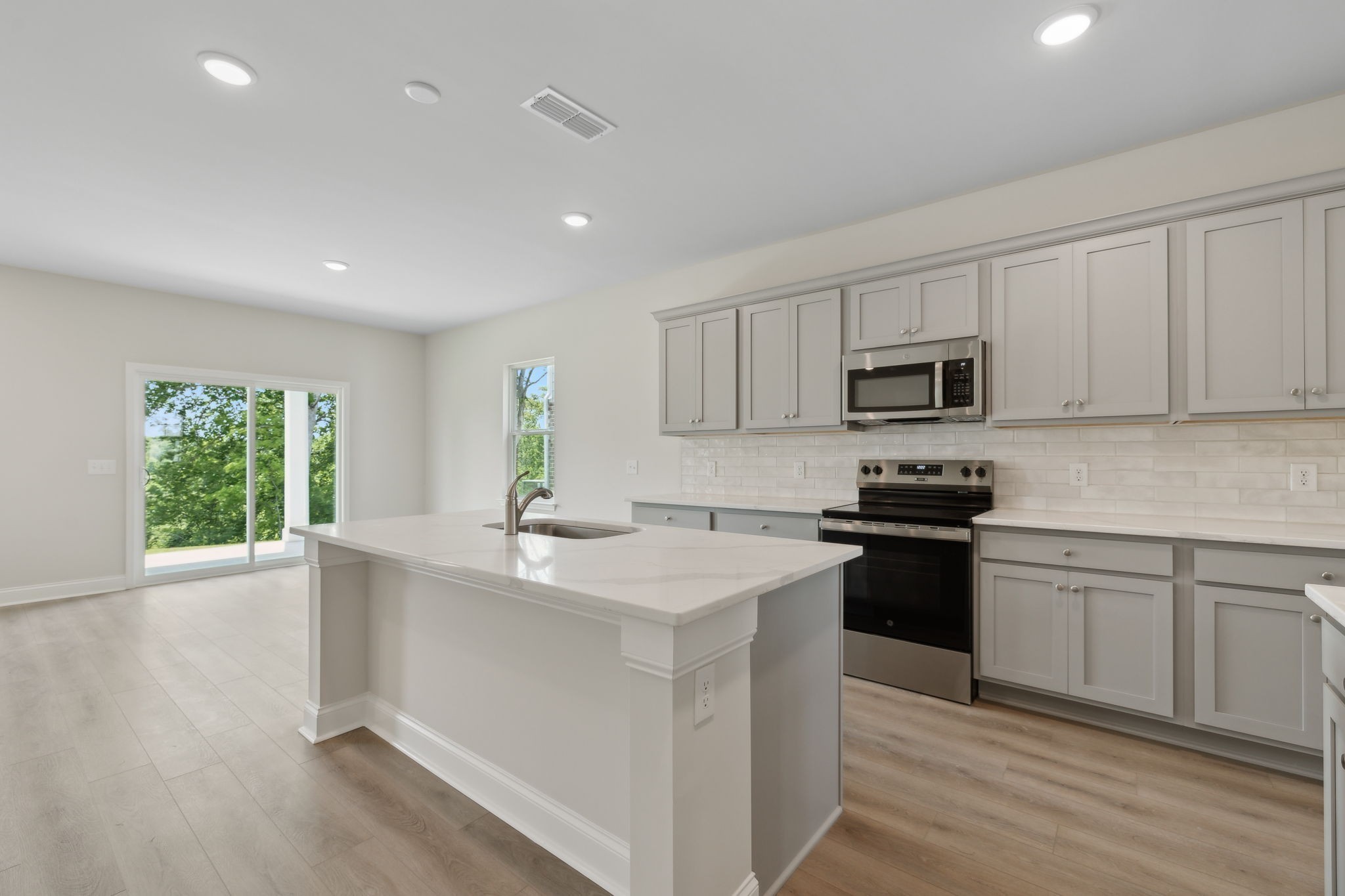 211 Limestone Way Mount Juliet, TN 37122 - Photo 18 of 35 a kitchen with a sink stove top oven and refrigerator