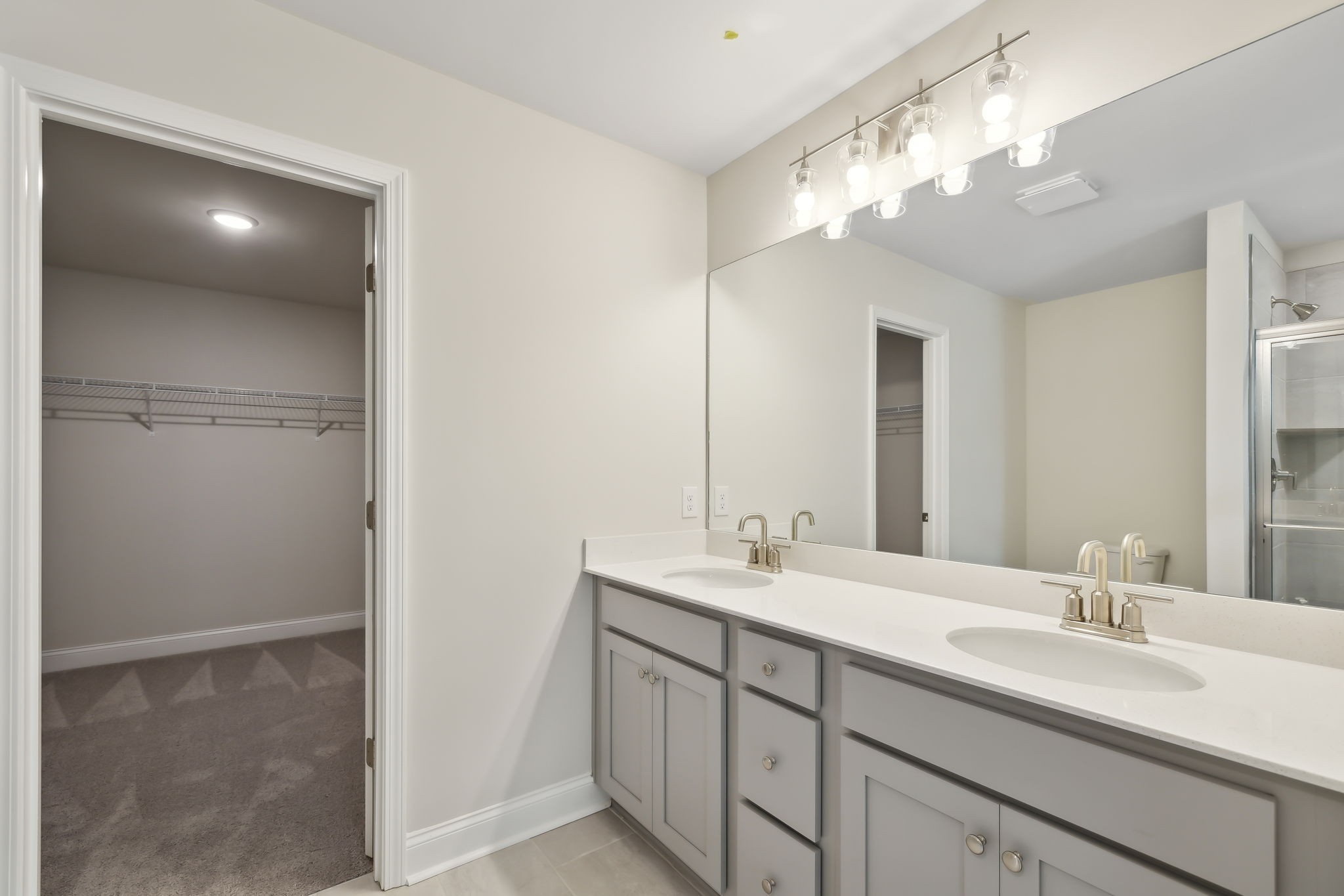 211 Limestone Way Mount Juliet, TN 37122 - Photo 22 of 35 a bathroom with a double vanity sink and a mirror