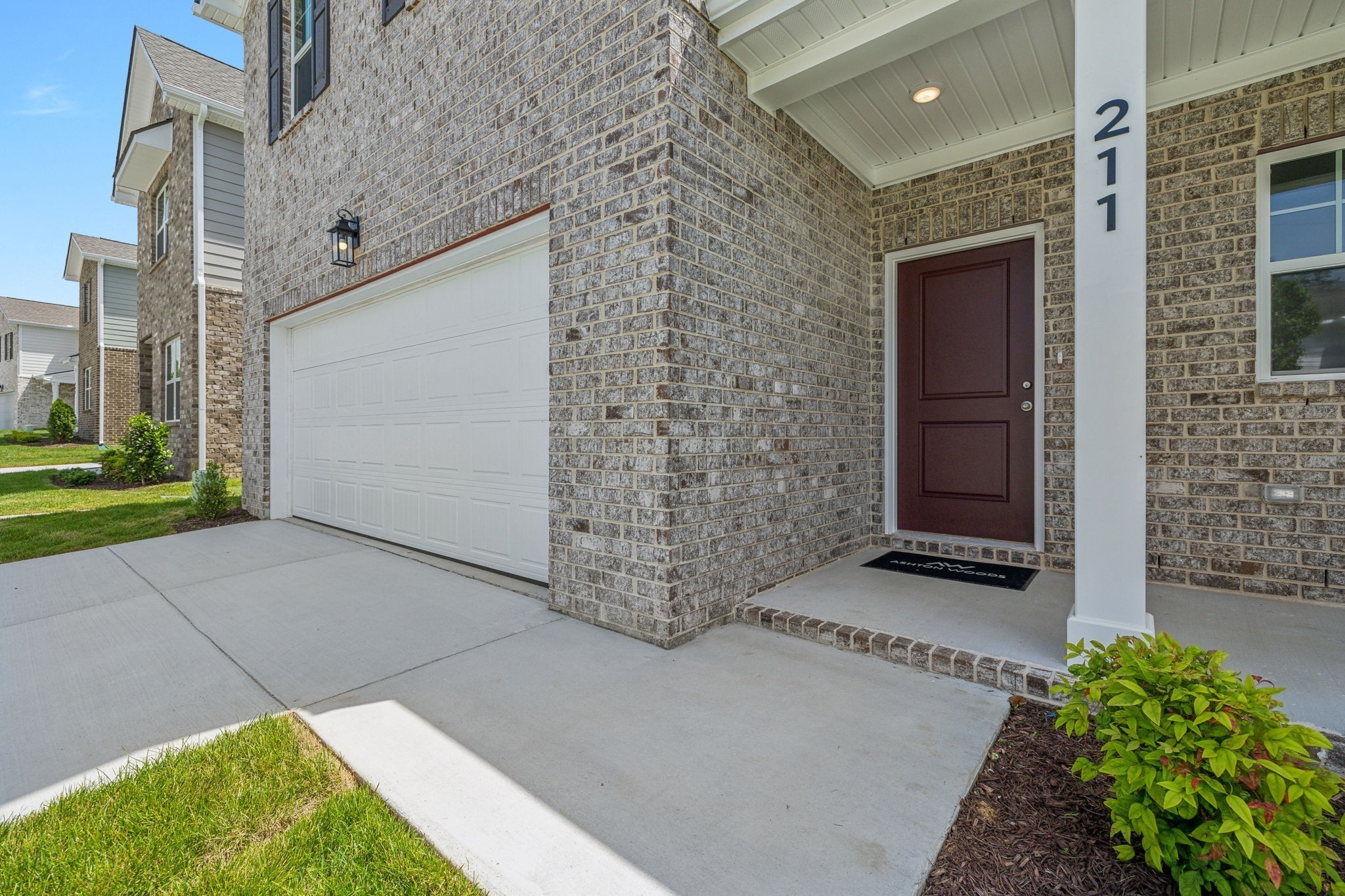 211 Limestone Way Mount Juliet, TN 37122 - Photo 3 of 35 a view of a brick house with a yard