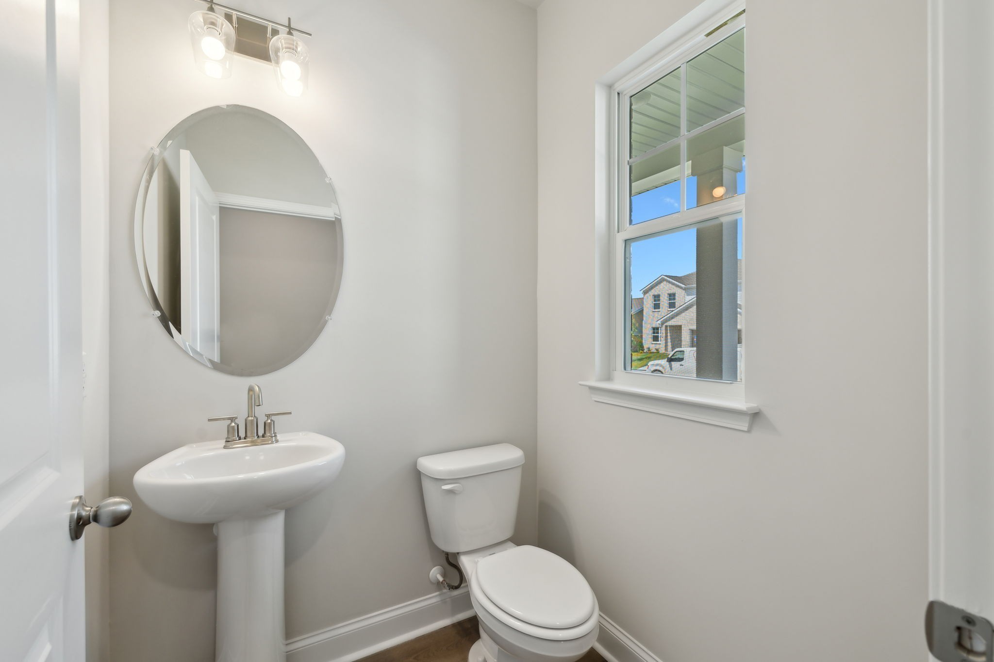211 Limestone Way Mount Juliet, TN 37122 - Photo 7 of 35 a bathroom with a toilet sink and mirror