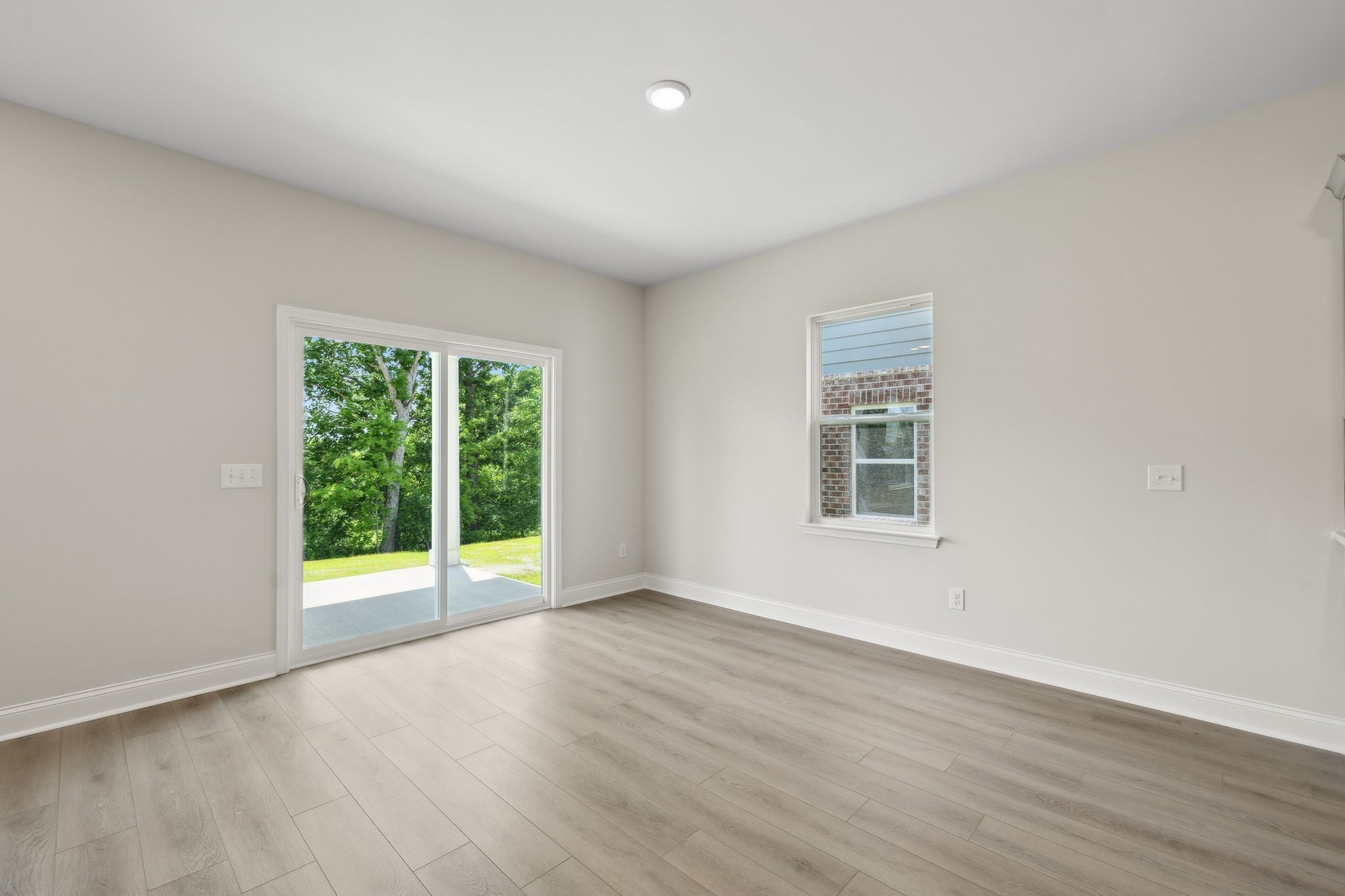 211 Limestone Way Mount Juliet, TN 37122 - Photo 9 of 35 a view of an empty room with wooden floor and a window