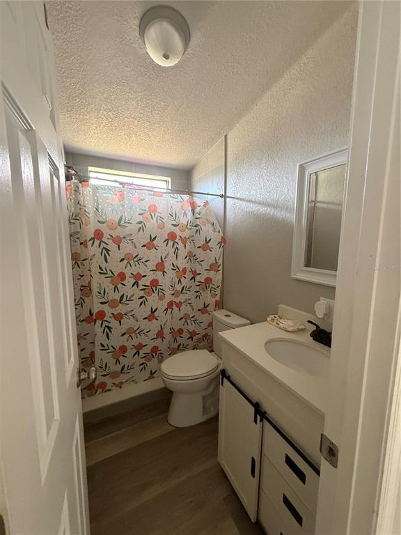 3431 Maple Drive Mulberry, FL 33860 - Photo 12 of 14 a bathroom with a sink toilet and shower