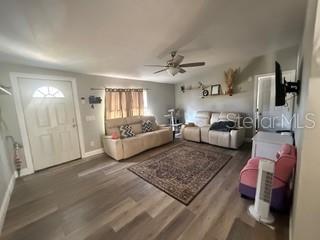 3431 Maple Drive Mulberry, FL 33860 - Photo 5 of 14 a living room with furniture and wooden floor