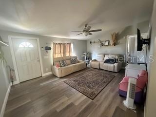 3431 Maple Drive Mulberry, FL 33860 - Photo 6 of 14 a spacious bedroom with a bed a couch and dresser