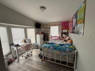 3431 Maple Drive Mulberry, FL 33860 - Photo 9 of 14 a room with furniture and a window