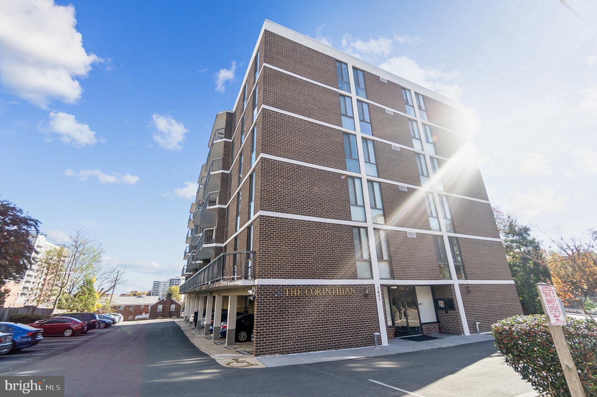 1401 North Rhodes Street, Unit 305 Arlington, VA 22209 - Photo 4 of 35 a view of a street with a building in the background