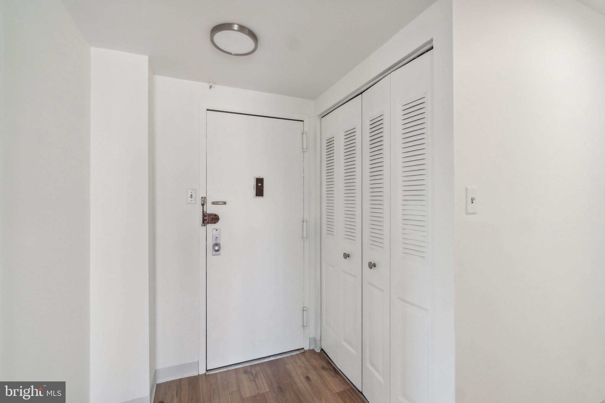 1401 North Rhodes Street, Unit 305 Arlington, VA 22209 - Photo 10 of 35 a view of a room with wooden floor