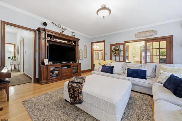 a view of a livingroom with workspace and a couch