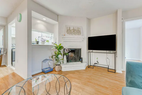 a bedroom with furniture flat screen tv and a bed