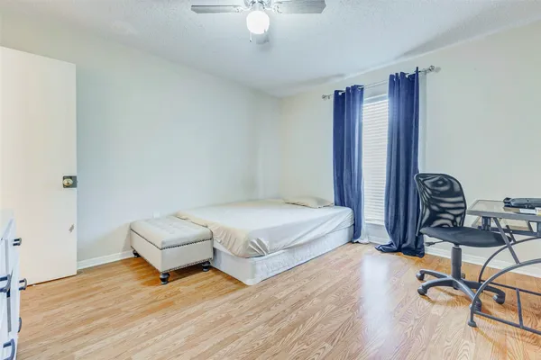 a bedroom with bed and window