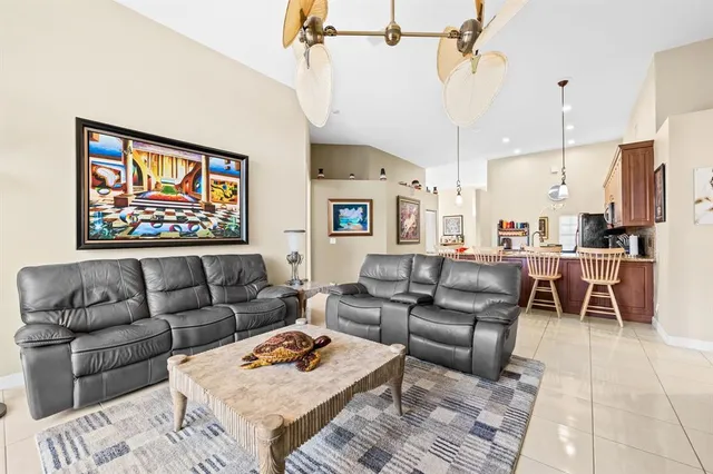 a bedroom with a bed and a flat tv screen on dresser