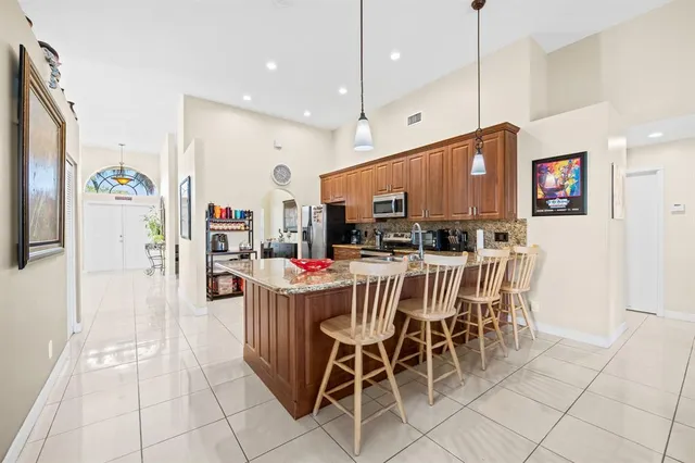 a spacious bathroom with a bathtub a sink and a large mirror