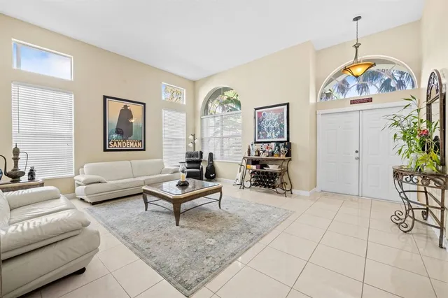 a kitchen with stainless steel appliances granite countertop a refrigerator stove top oven and sink