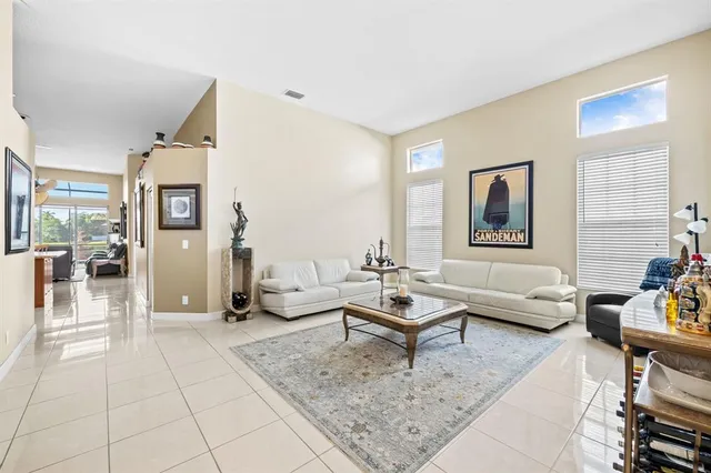 a kitchen with stainless steel appliances granite countertop a stove top oven a sink dishwasher and a refrigerator with cabinets