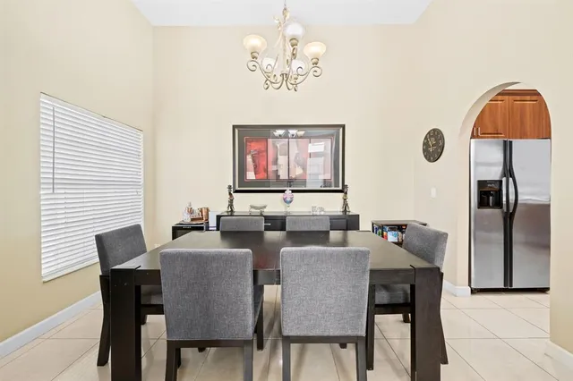 a kitchen with stainless steel appliances kitchen island granite countertop a stove a sink and dishwasher
