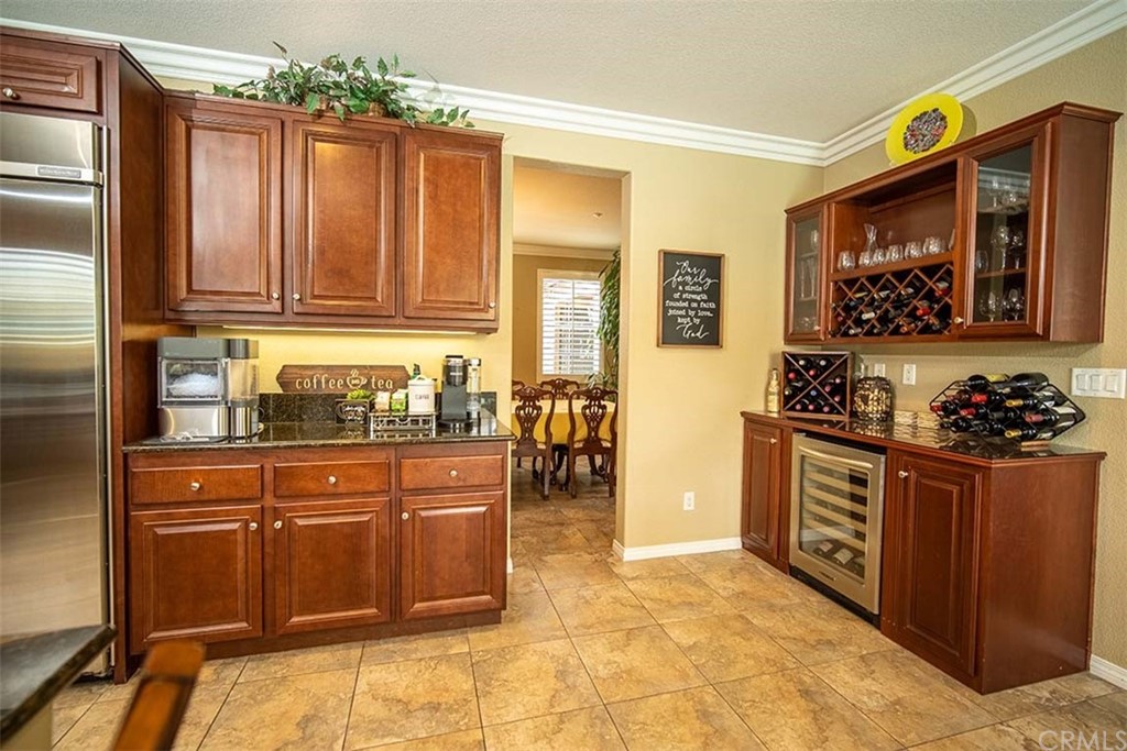 18622 Lurin Avenue Riverside, CA 92508 - Photo 12 of 33 a kitchen with stainless steel appliances granite countertop a stove and cabinets