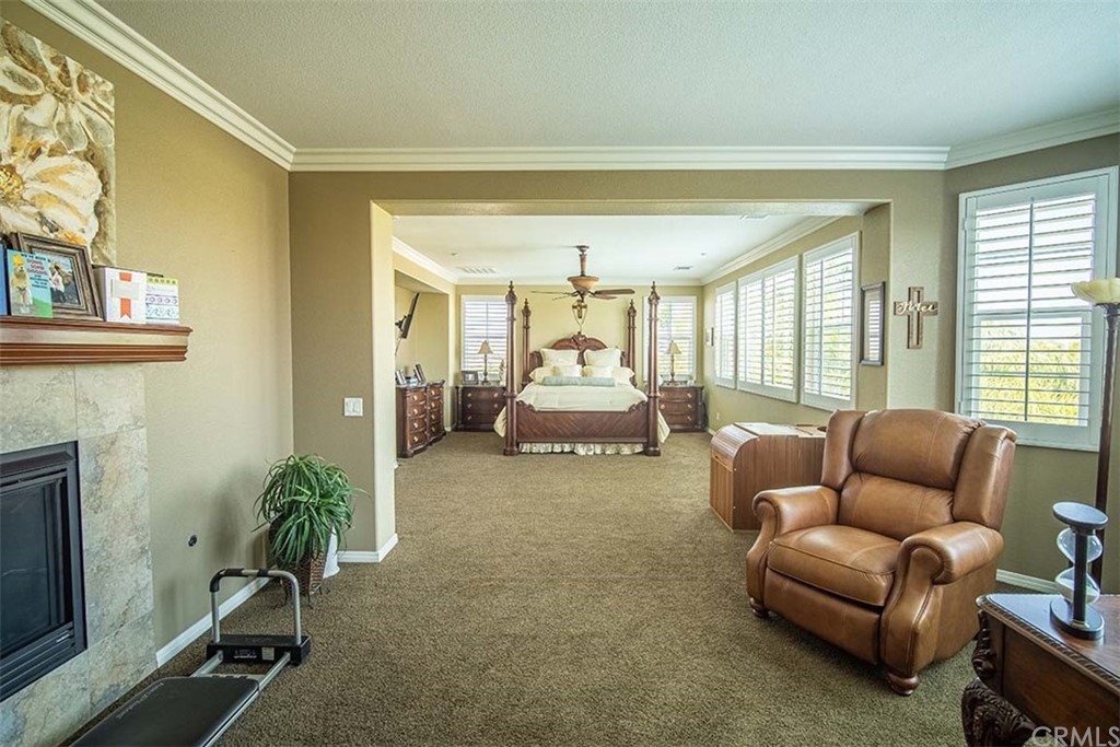 18622 Lurin Avenue Riverside, CA 92508 - Photo 19 of 33 a living room with furniture and a fireplace
