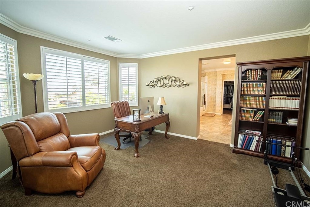 18622 Lurin Avenue Riverside, CA 92508 - Photo 20 of 33 a living room with furniture and a book shelf