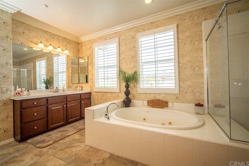18622 Lurin Avenue Riverside, CA 92508 - Photo 21 of 33 a spacious bathroom with a tub sink and mirror