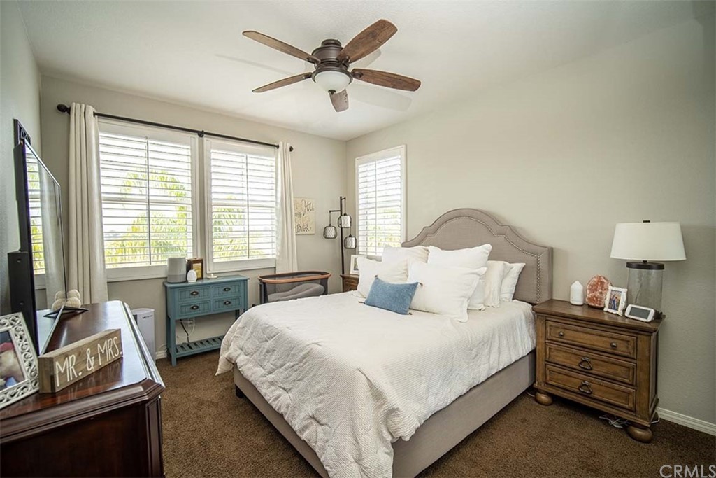 18622 Lurin Avenue Riverside, CA 92508 - Photo 23 of 33 a bedroom with a bed and a couch