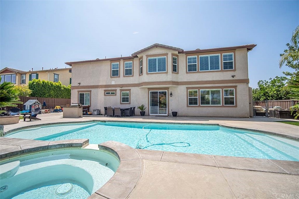 18622 Lurin Avenue Riverside, CA 92508 - Photo 29 of 33 a view of a house with a swimming pool