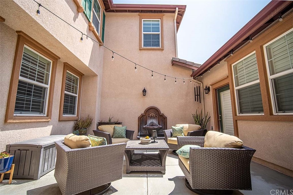 18622 Lurin Avenue Riverside, CA 92508 - Photo 5 of 33 a living room with furniture and windows