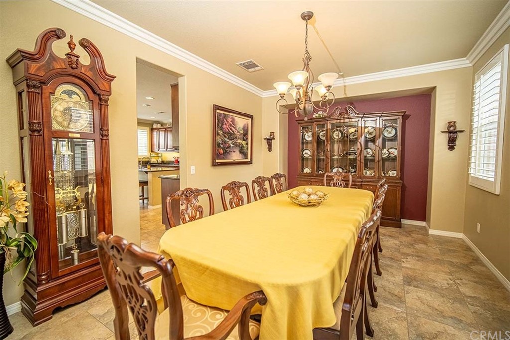 18622 Lurin Avenue Riverside, CA 92508 - Photo 7 of 33 a view of a dining room with furniture and a chandelier