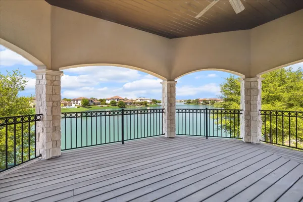 a view of a balcony with wooden floor