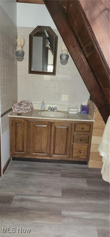 6699 Howard Road Williamsfield, OH 44093 - Photo 16 of 31 Details featuring vanity and hardwood / wood-style floors