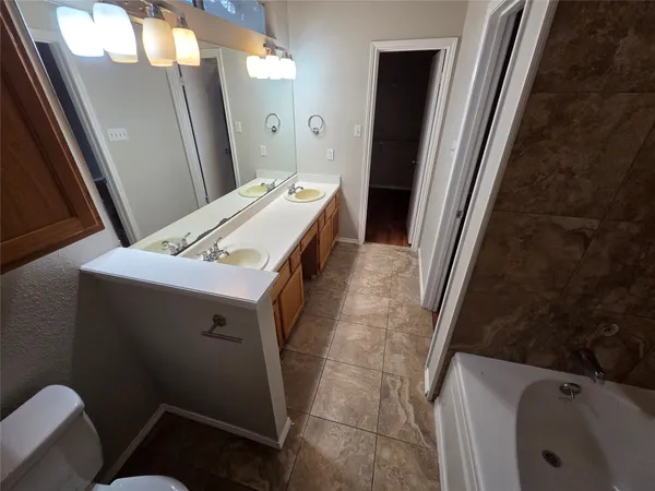a bathroom with sink and mirror