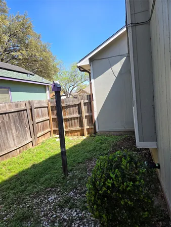 a view of backyard with a garden and plants
