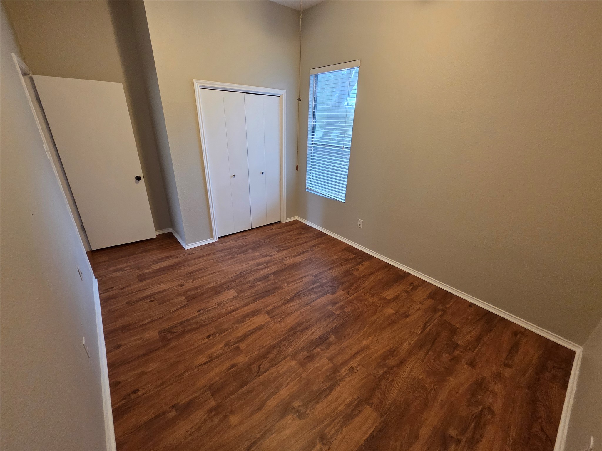 3001 Rochelle Drive Austin, TX 78748 - Photo 18 of 23 Unfurnished bedroom featuring dark wood-type flooring and a closet