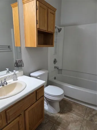 a kitchen with stainless steel appliances a refrigerator and a stove