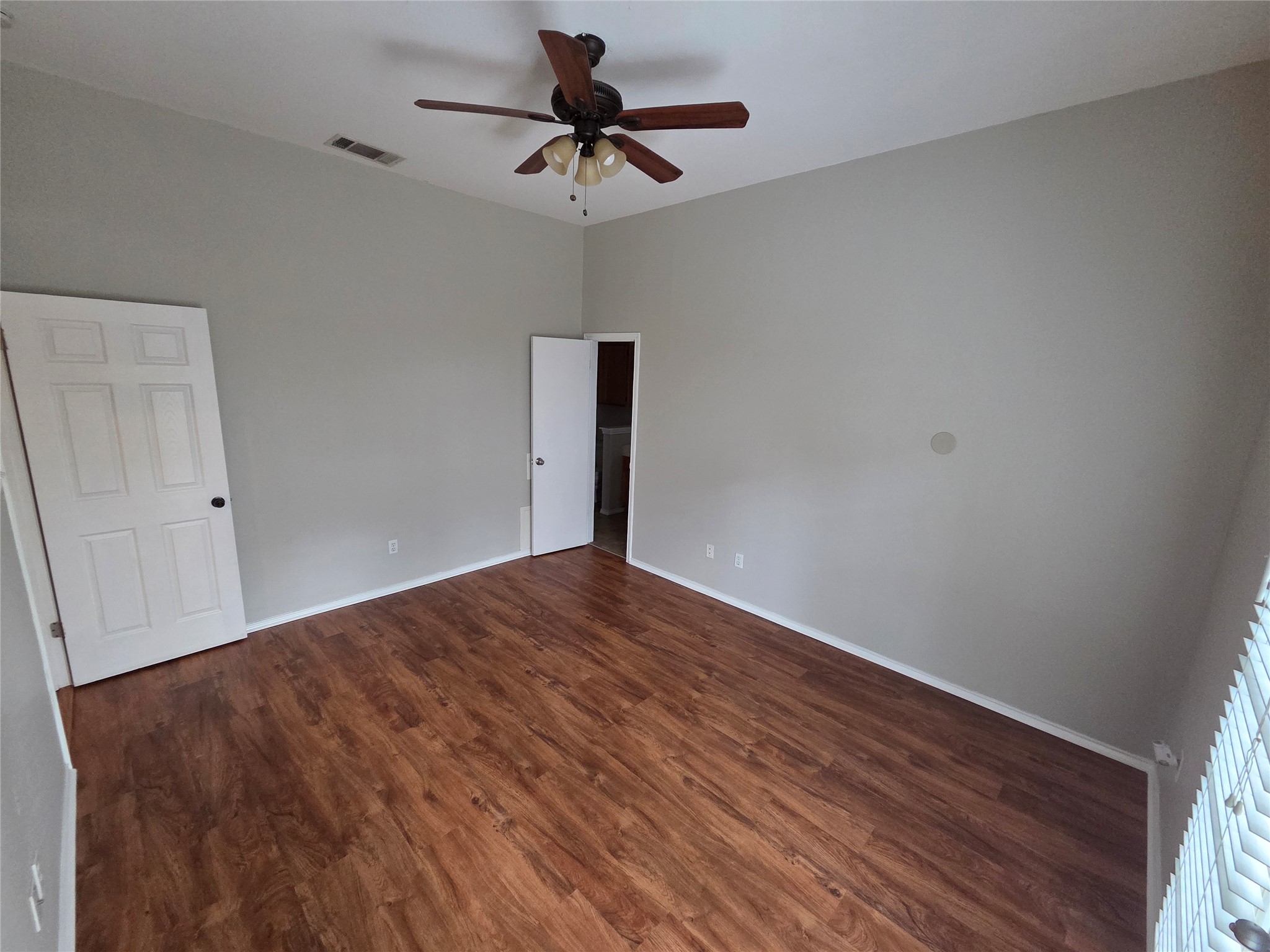 3001 Rochelle Drive Austin, TX 78748 - Photo 10 of 23 Unfurnished bedroom with dark wood-type flooring and a ceiling fan