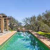 a view of a swimming pool with a patio